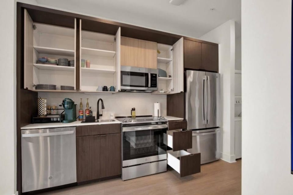 Modern full kitchen with stainless appliances and ample storage