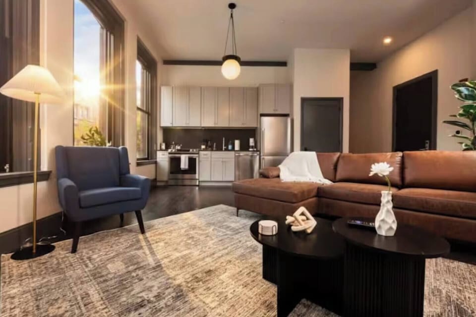 Bright open living space with modern kitchen and cozy seating