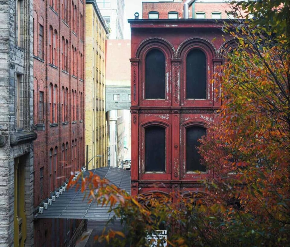 Charming city view with historic brick architecture and autumn foliage