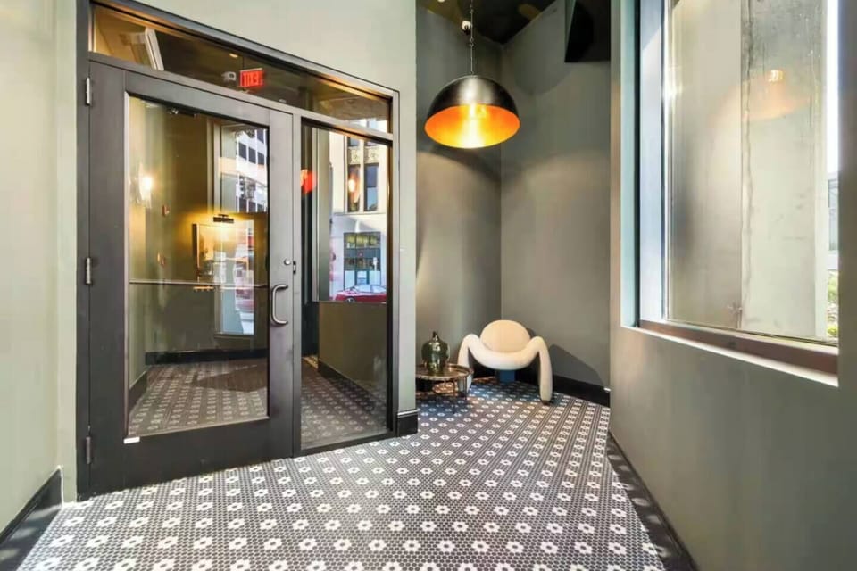 Boutique-style lobby entrance with designer lighting and modern seating