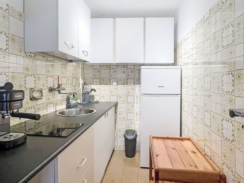 Flooring, Kitchen, Major Appliance, Kitchen Appliance, Countertop, Floor, Interior Design, Plumbing Fixture, Cabinetry, Sink