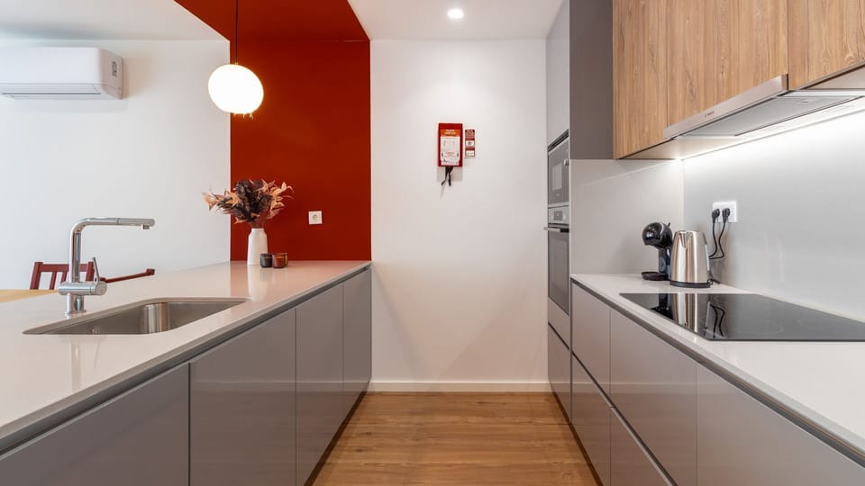 Experience culinary convenience in this sleek kitchen, where modern design meets functionality, allowing you to prepare meals with ease and enjoy a seamless cooking experience. The bright, well-lit space ensures every detail for your homemade delights is 