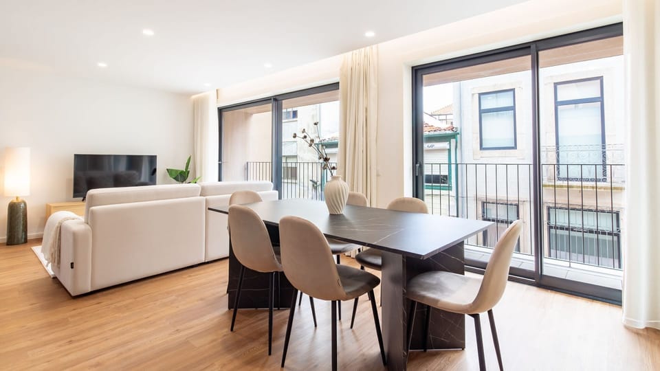 Unwind in the bright and airy living room, where comfortable seating invites you to relax after a day of exploration. Step out onto the private balcony to enjoy fresh air and views of the charming street below.