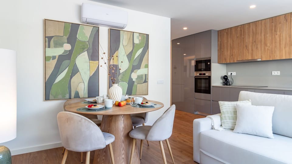 Enjoy the seamless flow of this open-concept space, where cooking, dining, and relaxation blend effortlessly under stylish decor, ensuring a comfortable and connected stay.