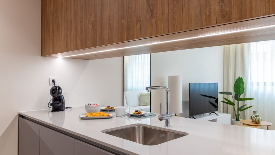 Start your day right with a delicious espresso from the modern kitchen, perfectly positioned to keep you connected to the cozy living space and your fellow travelers. The sleek design and thoughtful layout make meal prep a joy, whether you're grabbing a q