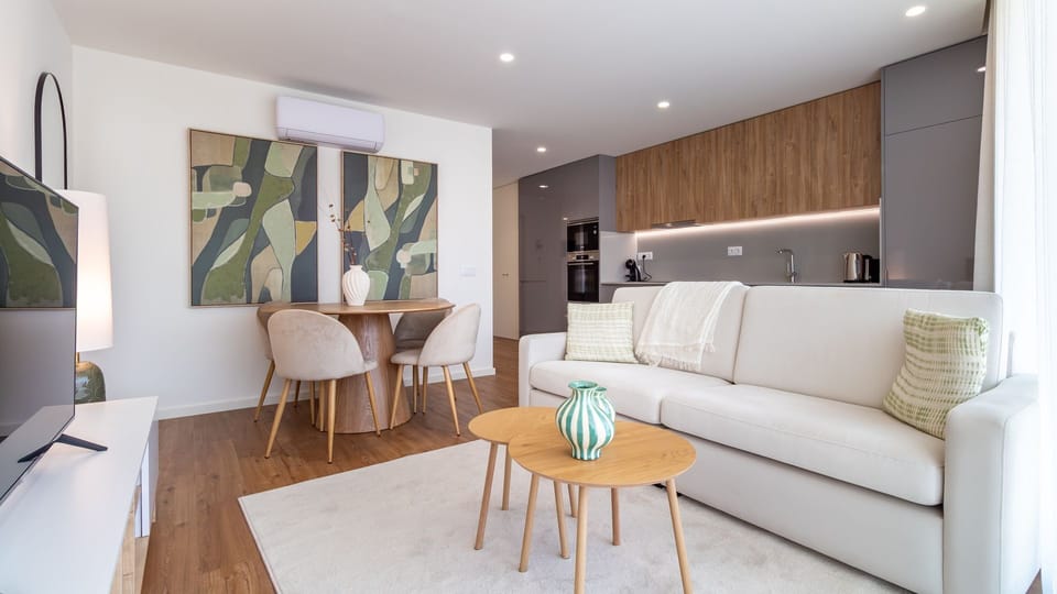 Step into a bright, open-plan living area where comfort meets modern design, perfect for relaxing after a day of exploring or enjoying a home-cooked meal. The seamlessly integrated kitchen invites you to prepare delicious dishes while staying connected wi