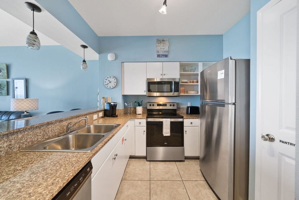 Fully Stocked Kitchen with Drip Coffee Maker, Keurig, Breakfast Bar Seating and Stainless Steel Appliances