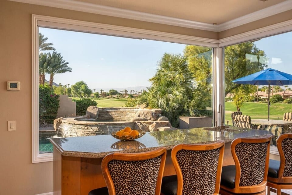 Golf Room: leather sectional sofa, 65` smart tv with built in media cabinet, wet bar with (4) bar stools, mini fridge