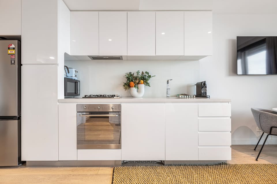 Prepare anything from a quick breakfast to a home-cooked dinner in a sleek kitchen equipped with a full-size refrigerator, oven, stovetop, espresso machine and essentials.