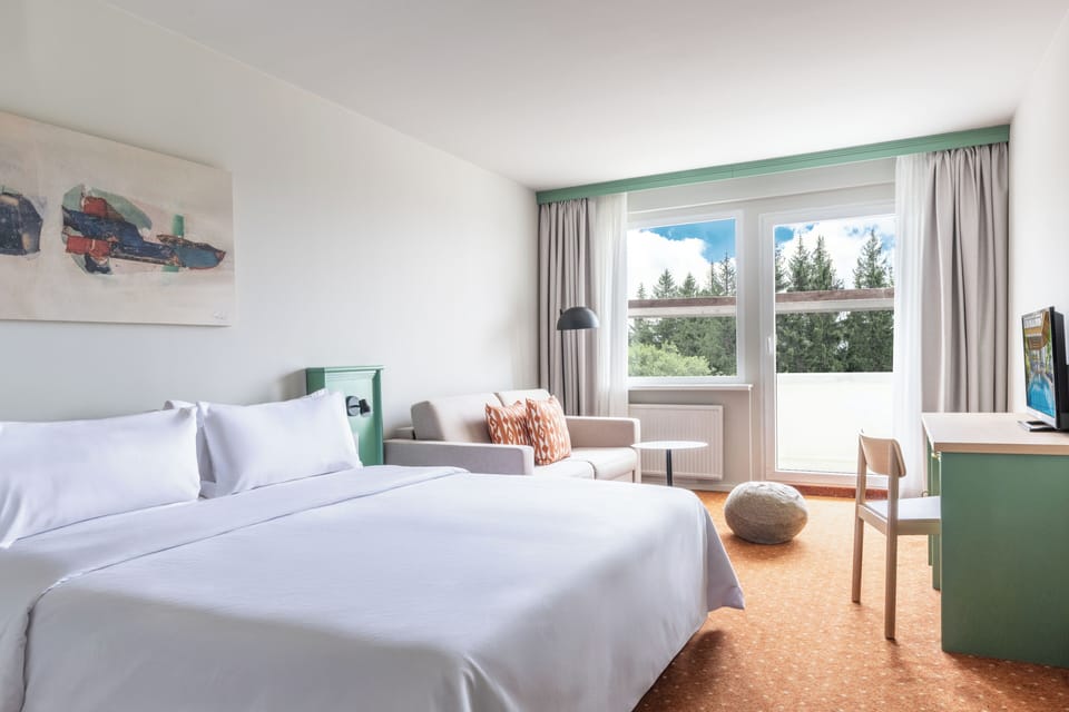 Family Room - incl. 1x 2 h entry to the adventure pool p. P. / night (without use of sauna) | Iron/ironing board (on request), WiFi (free), bed sheets
