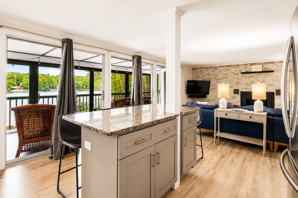 Open kitchen and living space at this Locke Lake getaway near Winnipesaukee.