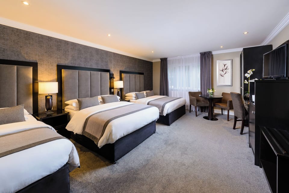 Family Room | Premium bedding, laptop workspace, iron/ironing board (on request)