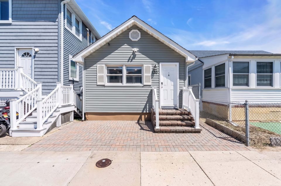 Charming coastal cottage with private parking and inviting curb appeal