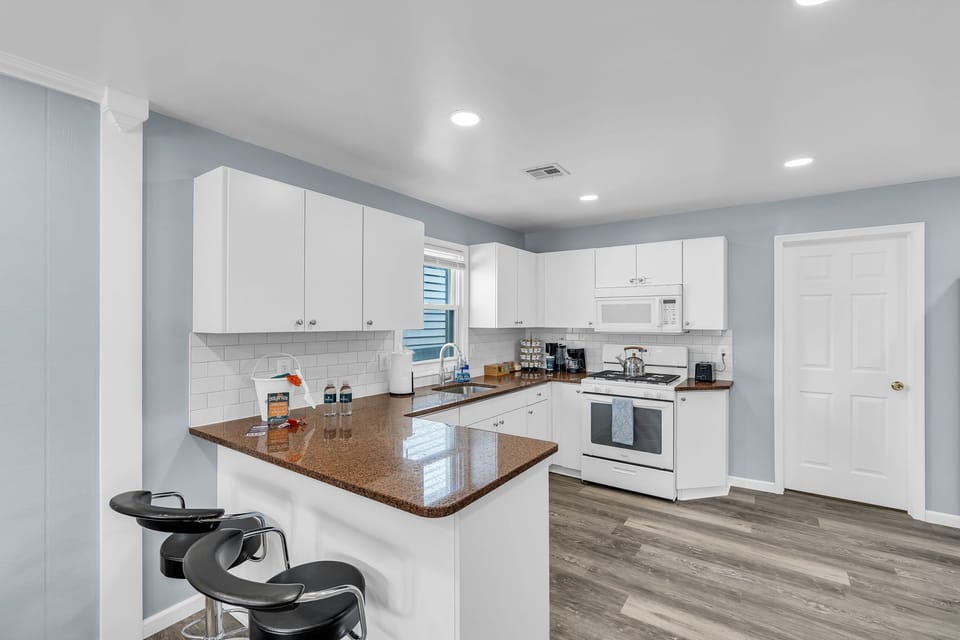 Bright modern kitchen with breakfast bar and stylish updated finishes
