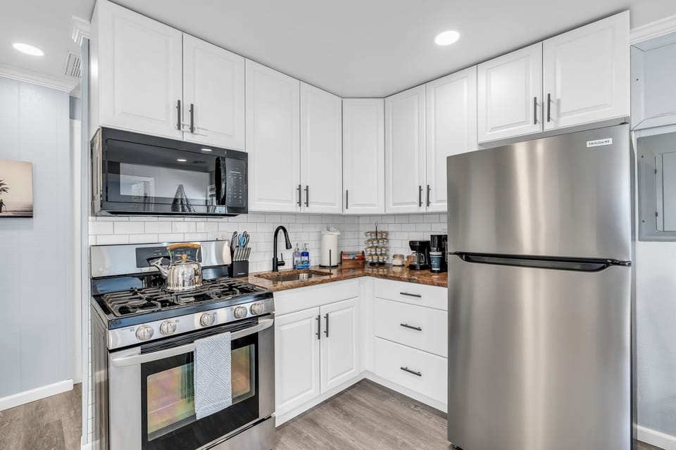 Bright modern kitchen with stainless appliances and ample storage
