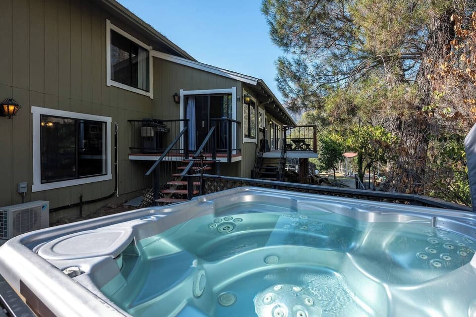 Soothing Hot Tub – Relax surrounded by trees and fresh mountain air.