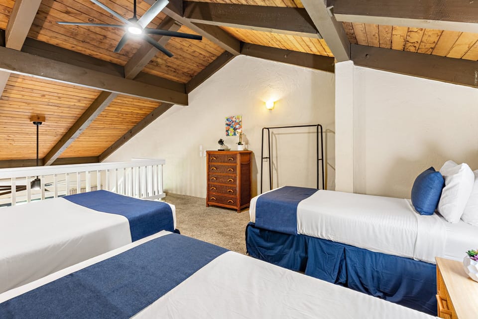 Comfortable beds and island-inspired details create a relaxing space for a restful night.