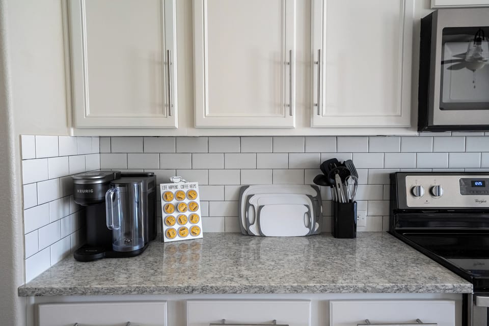 Bright modern kitchen with coffee station and well-equipped prep space