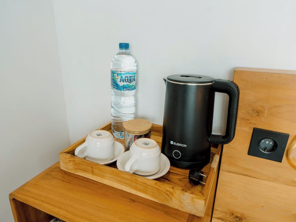Deluxe Room | Coffee and/or coffee maker