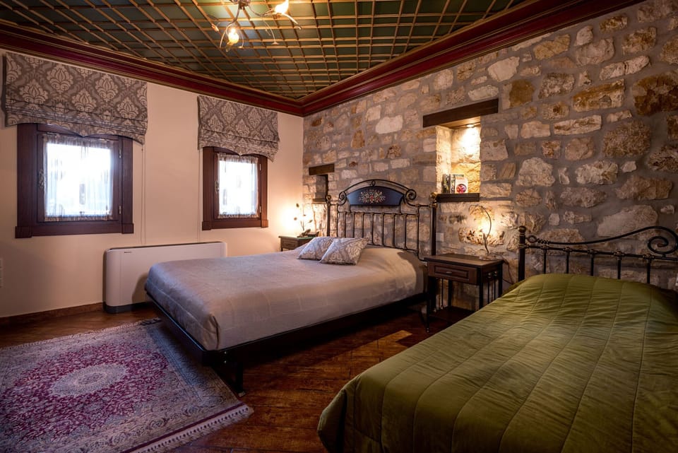 Triple Room – Cozy Bedroom with Traditional Stone Features