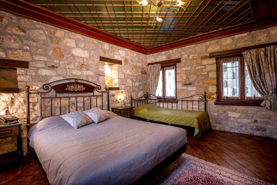 Triple Room – Comfortable Double Bed & Traditional Stone Interior