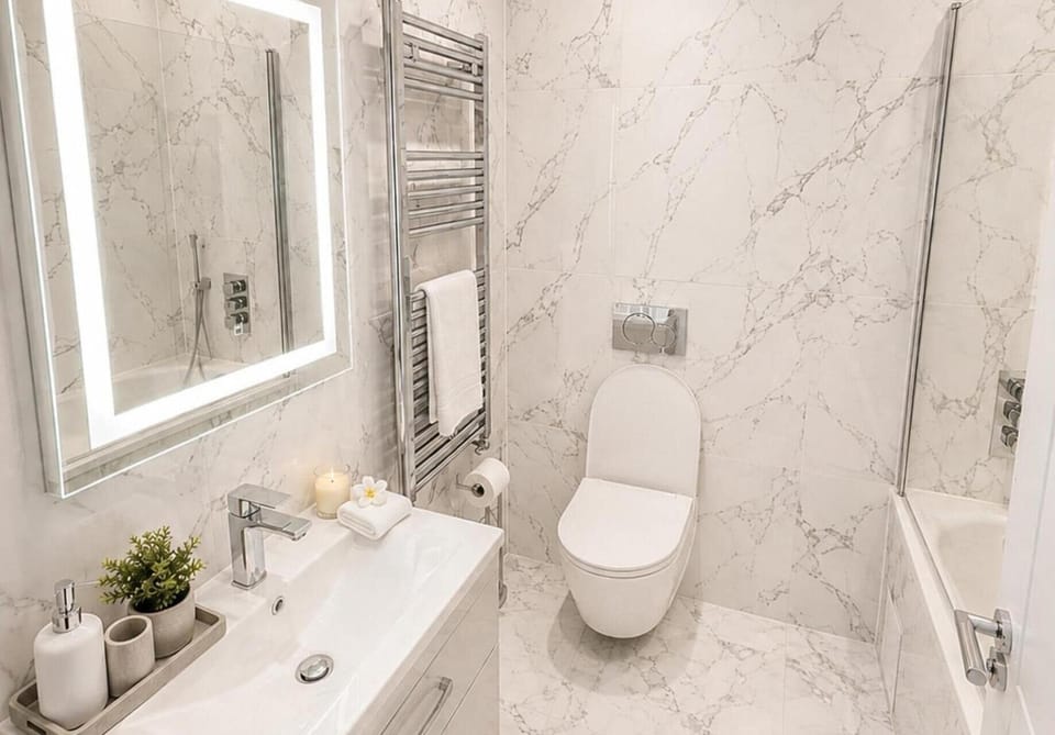 Separate tub and shower, deep soaking tub, towels