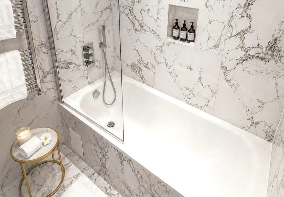 Separate tub and shower, deep soaking tub, towels