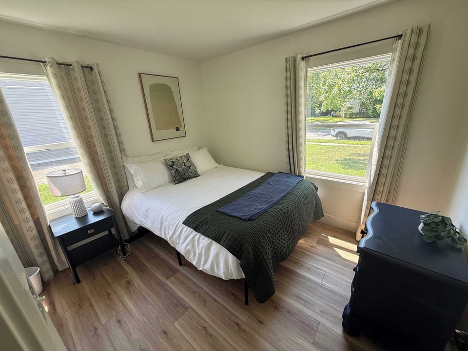 Bedroom with natural light and hardwood floor