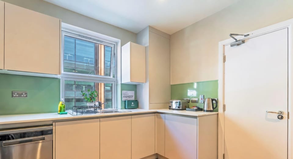 Bright kitchen with ample storage and practical cooking space.