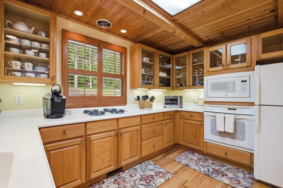 Kitchen | Gas Cooktop & White Appliances | Wood Cabinetry