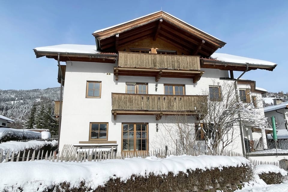 Winter exterior of KitzAlps Apartment in Kirchberg, centrally located for ski vacations in the Brixental and Kitzbühel Alps.