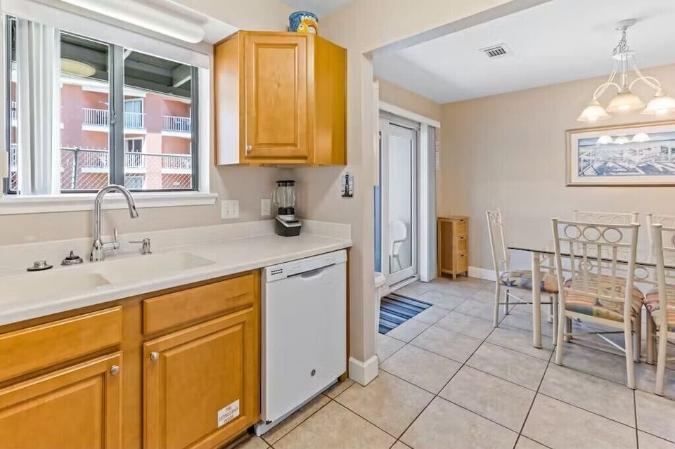 Kitchen with dishwasher, coffee maker, and generous counter space