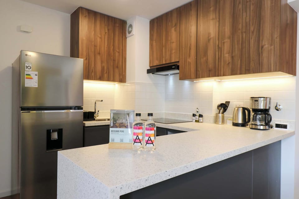 Fully equipped kitchen with modern appliances.