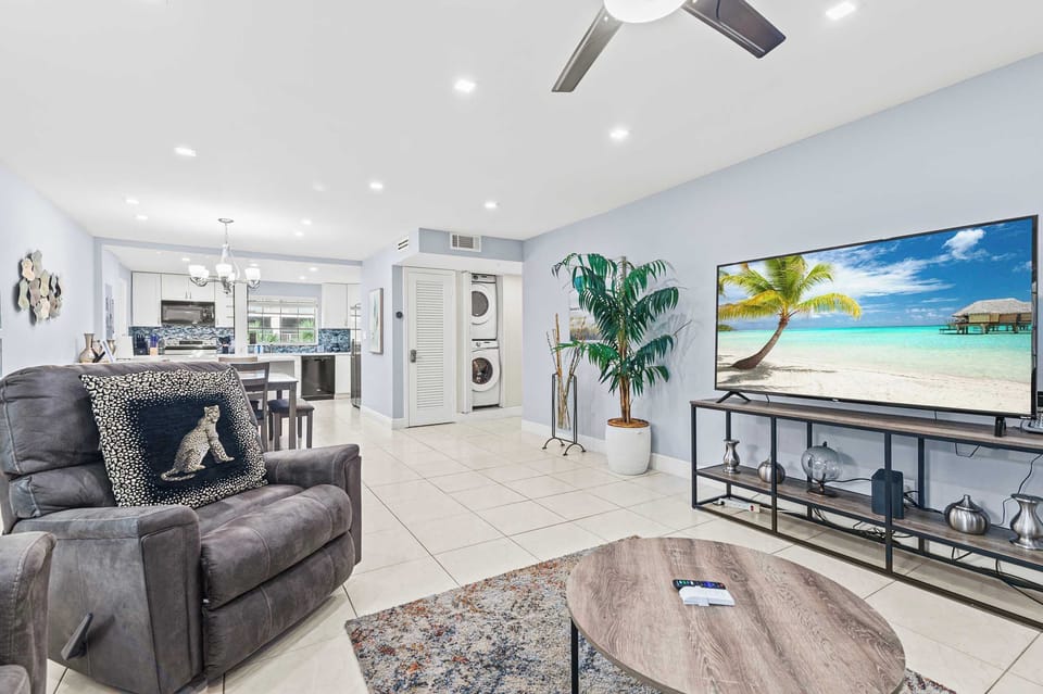 Spacious living room with comfortable seating and Smart TV.