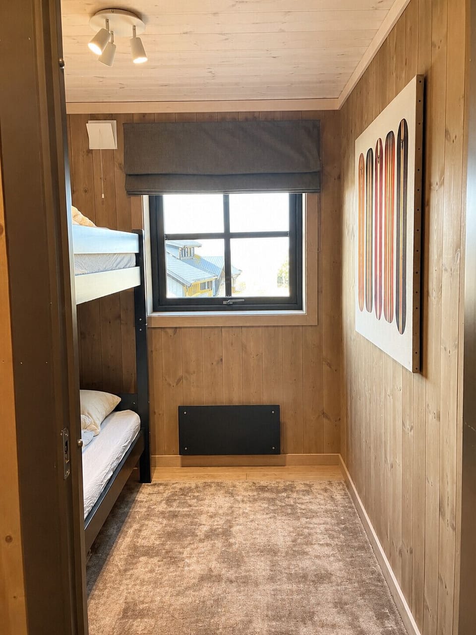 Compact and cozy bedroom with bunk bed perfect for kids or extra guests in a mountain getaway.