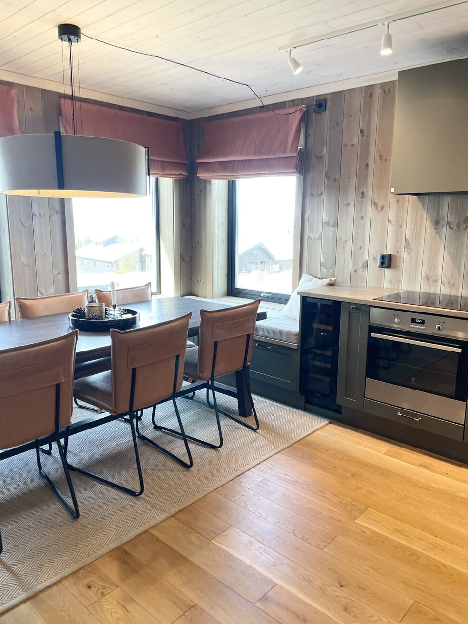 Open-plan dining area next to kitchen for easy serving.