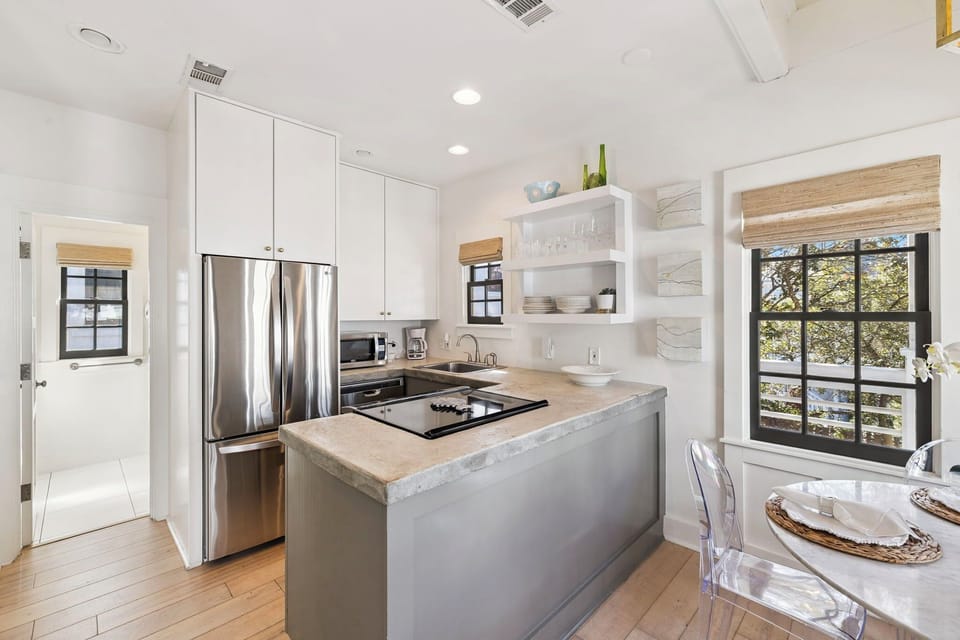 Your sleek kitchen features modern appliances and bright island for easy meal preparation.