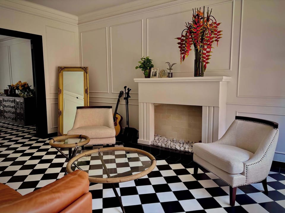 Elegant living area with stylish seating, and decorative accents.
