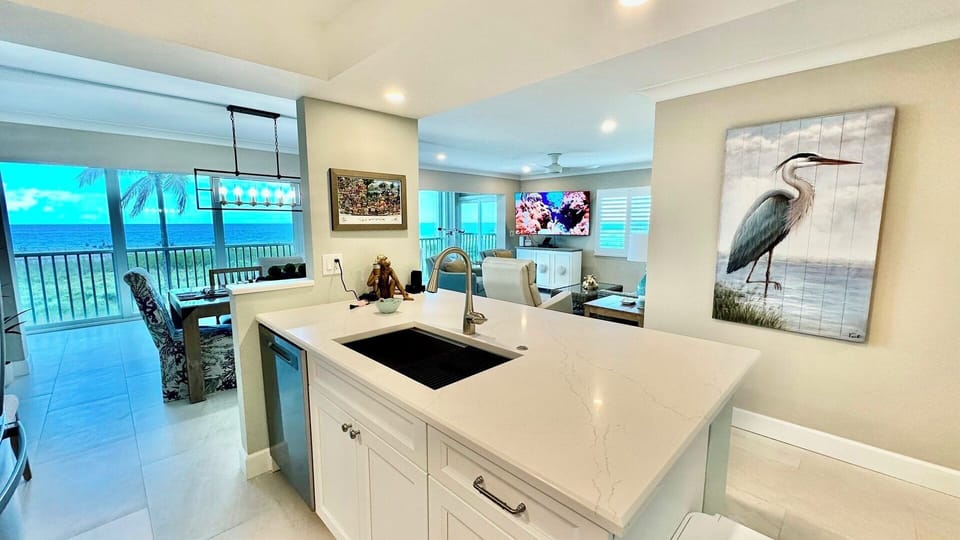 Quartz countertops, magnificent art throughout.