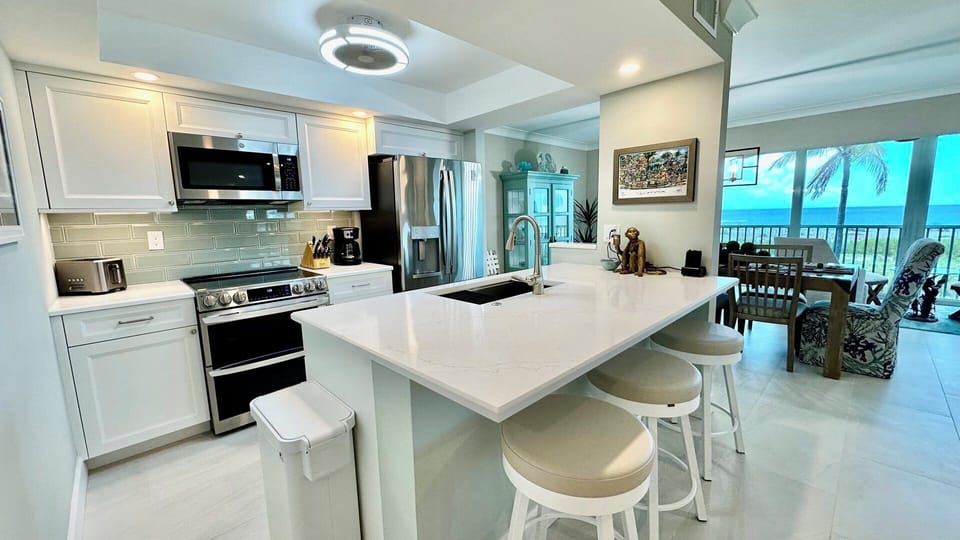 Bar seating for 3, stainless appliances.