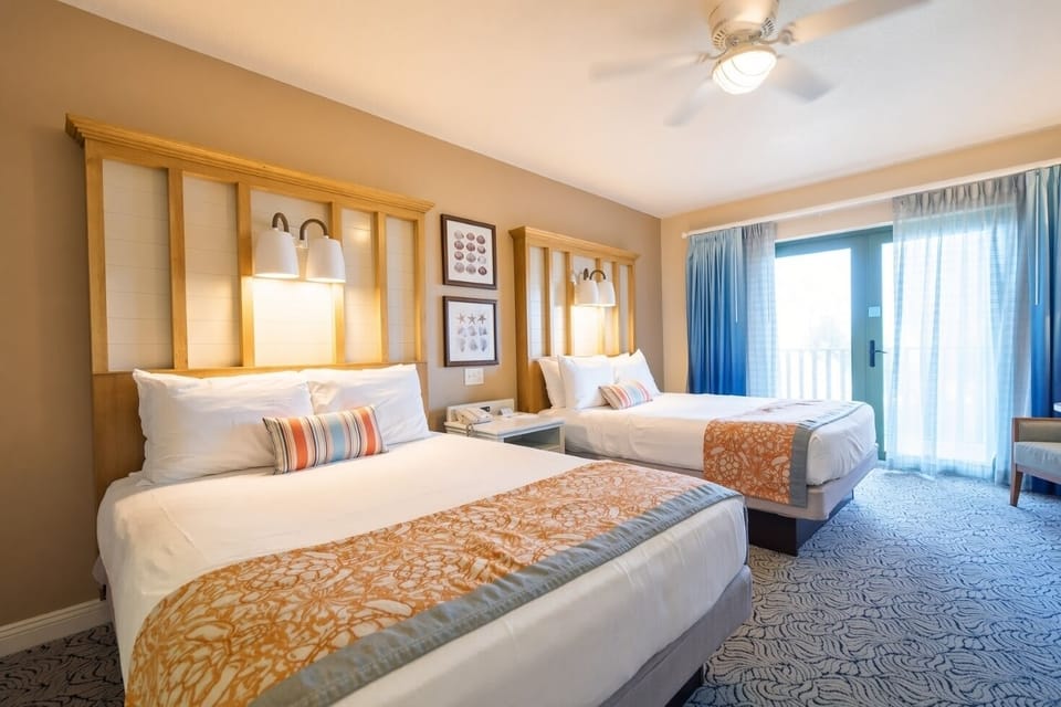 Deluxe Inn Room • Two Queen Beds & Balcony Access
