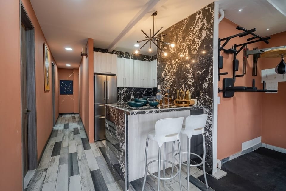 Full-size fridge, microwave, cookware/dishes/utensils