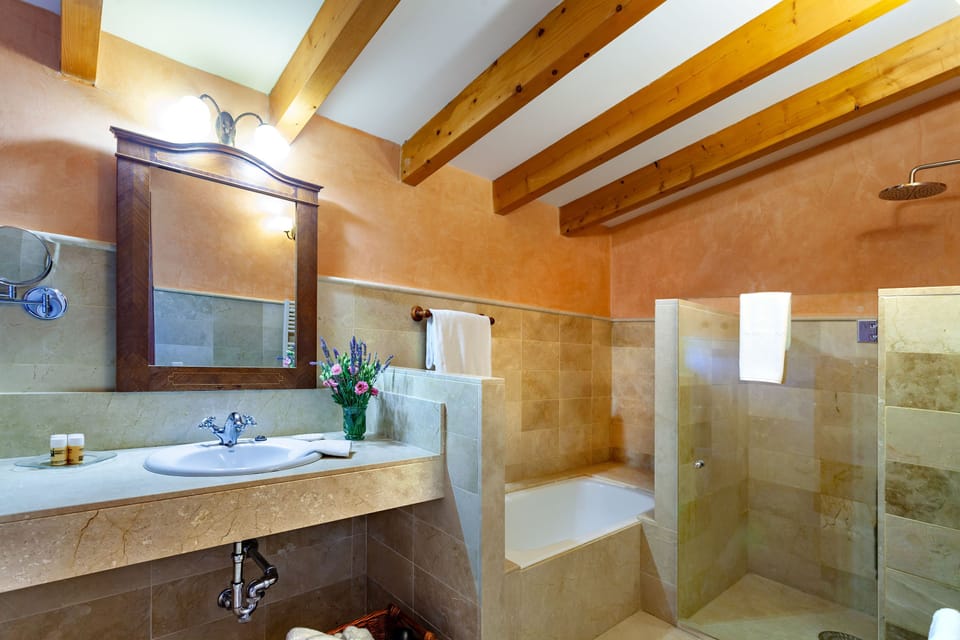 Junior Suite, Terrace | Bathroom | Deep soaking tub, free toiletries, hair dryer, bathrobes