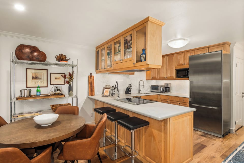 Fully-equipped kitchen with dining area.