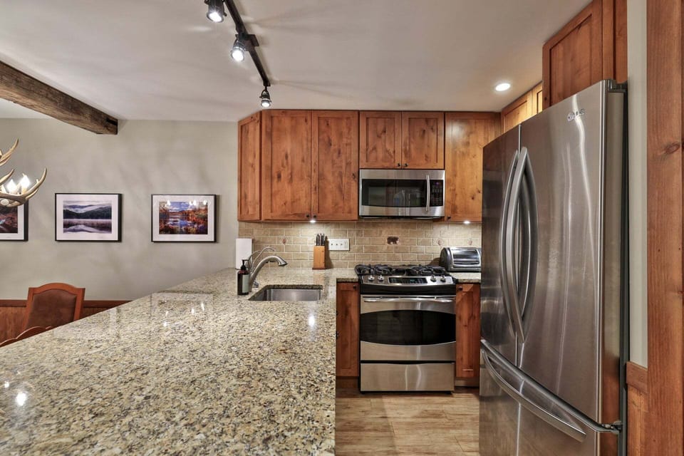 Spread out across the granite counters and cook with full-size stainless appliances close at hand.