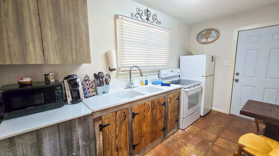 The cozy kitchen is well equipped for an unforgettable getaway​