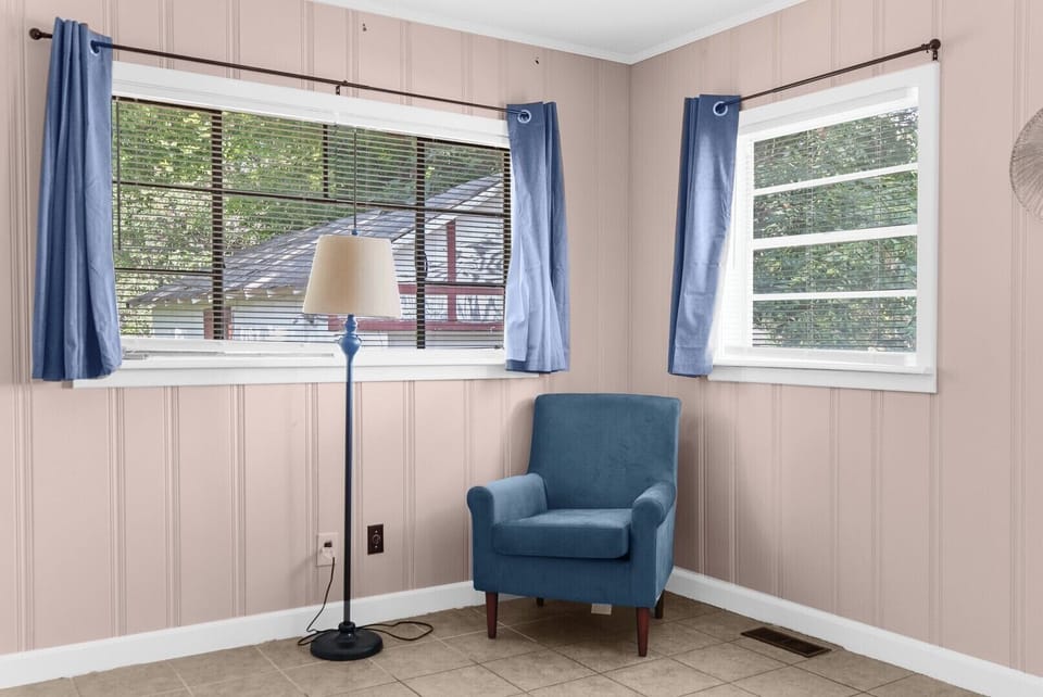 A little bonus space—this laundry area also features a chair and floor lamp, offering a quiet spot to sit, relax, or take a quick break.