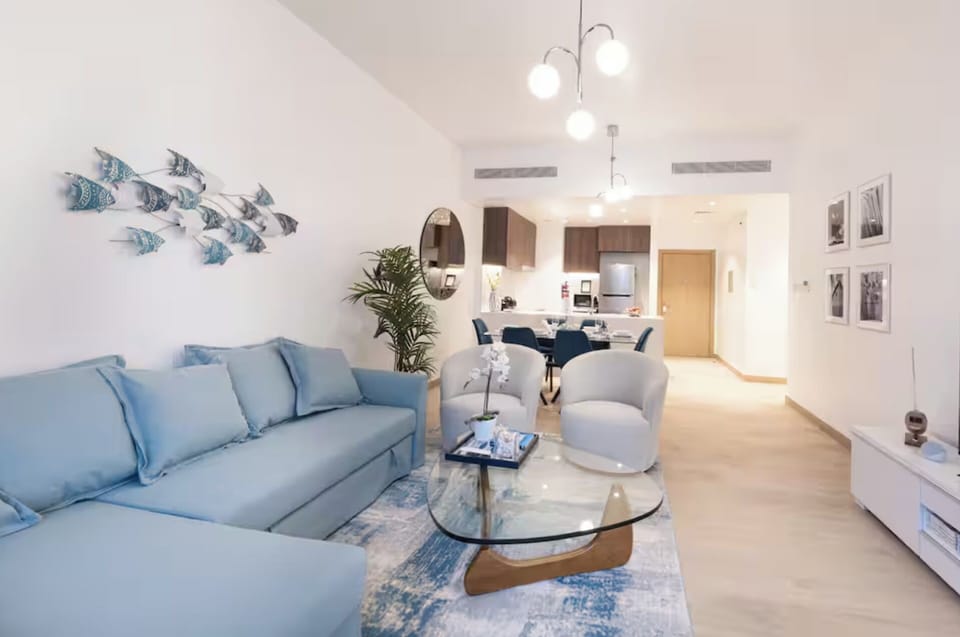 Deluxe Apartment, Balcony, Sea View | Living area | 55-cm flat-screen TV with digital channels