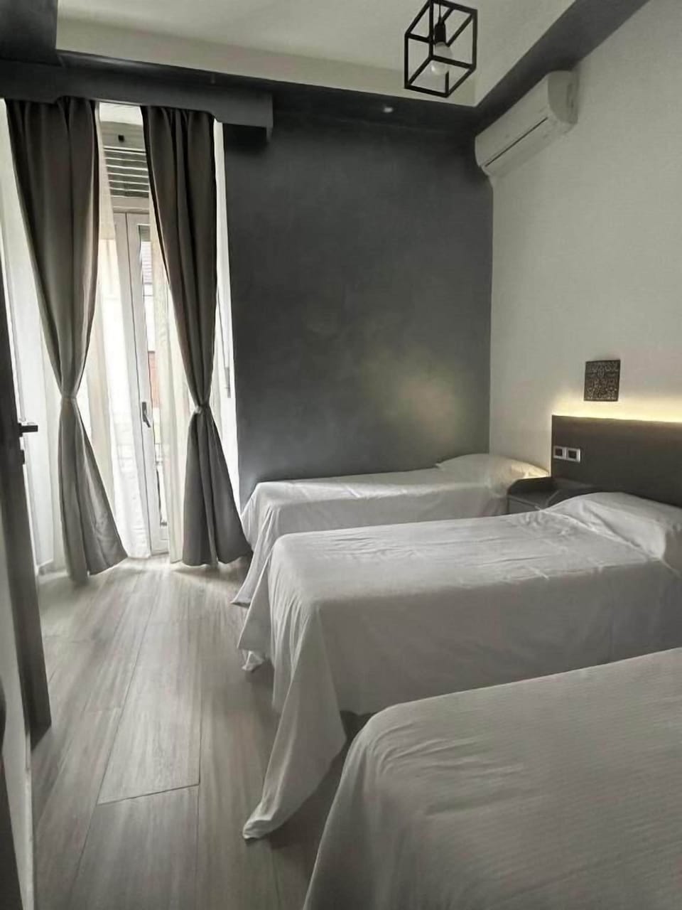 Basic Triple Room, Balcony | Iron/ironing board (on request), WiFi (free)