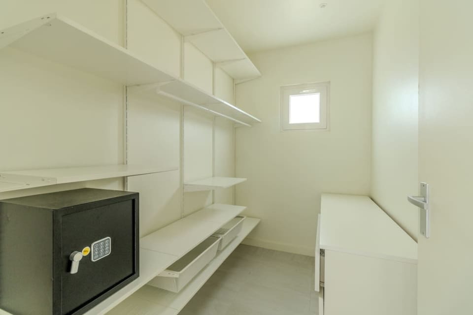 With walk-in closet, with plenty of storage space and a private safe for your belongings.